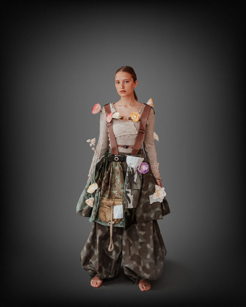 a woman is dressed in a dress with flowers on it