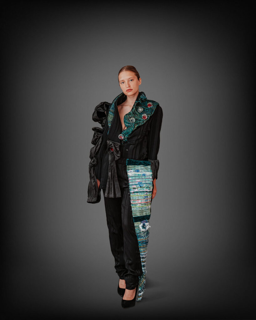 a woman in a black top and black pants