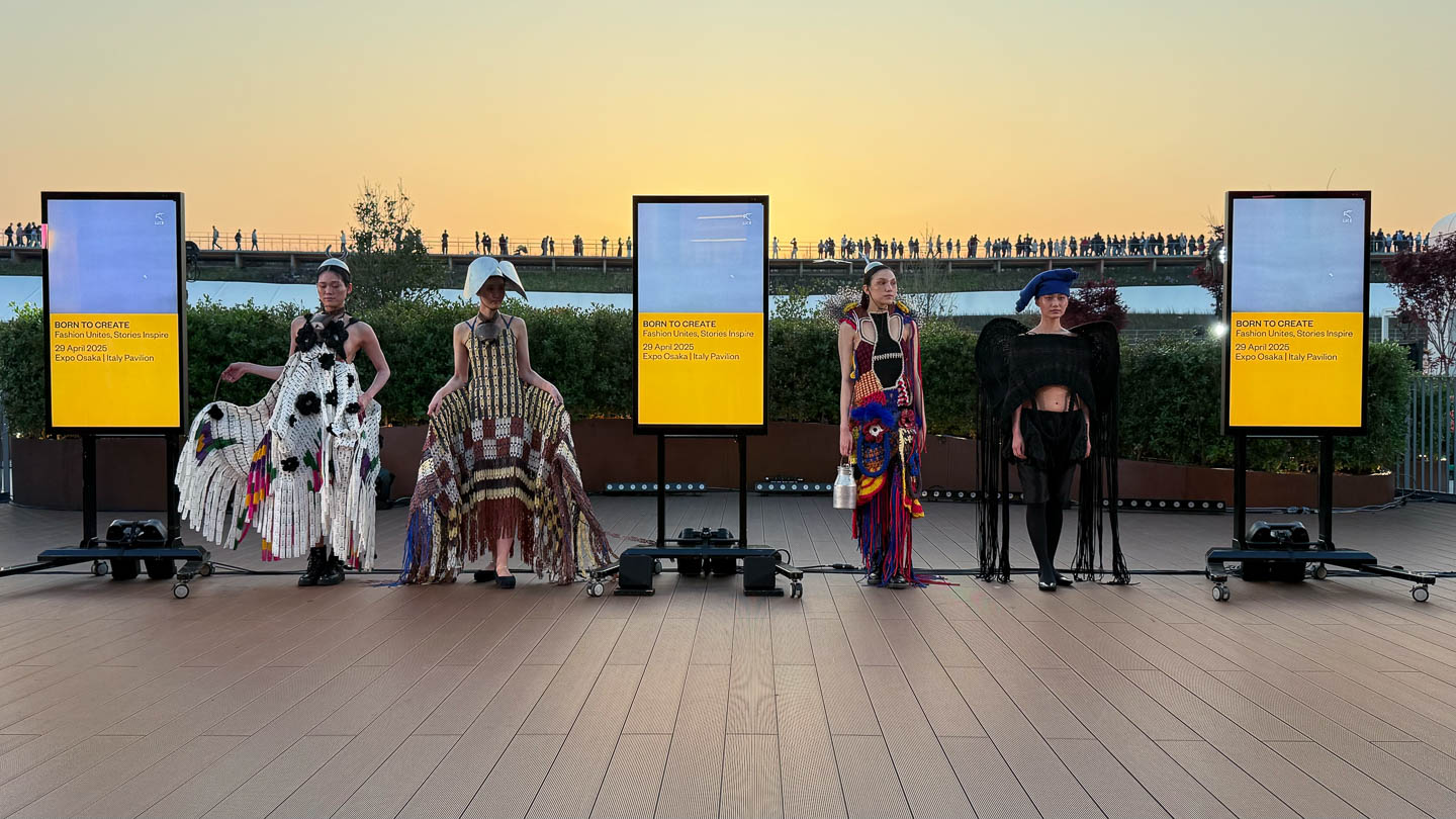 a group of people standing on top of a wooden floor