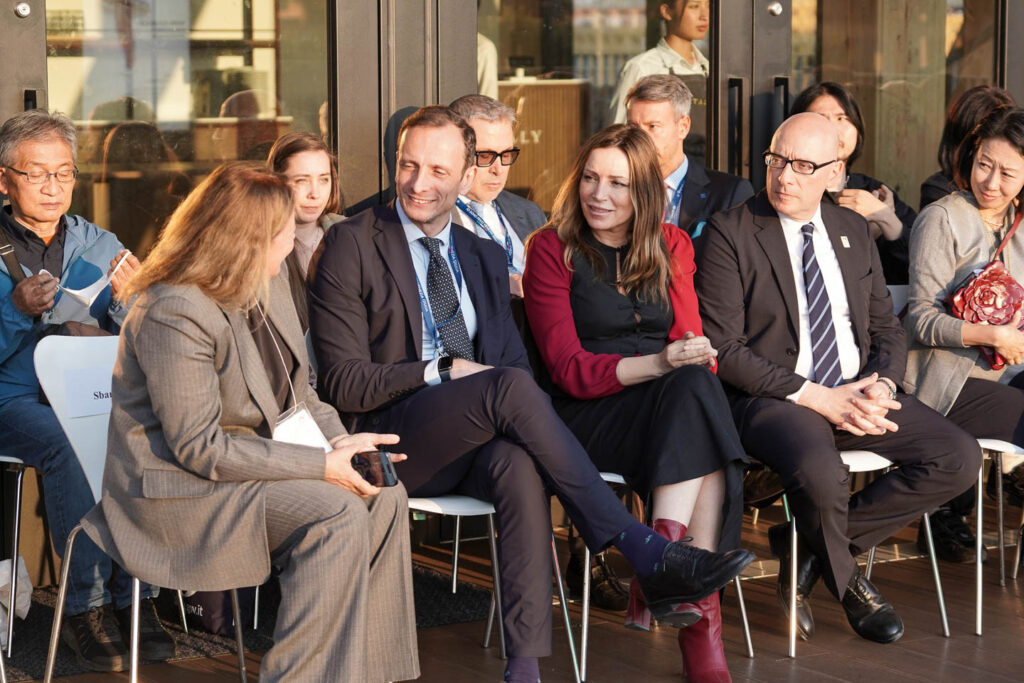 a group of people sitting next to each other