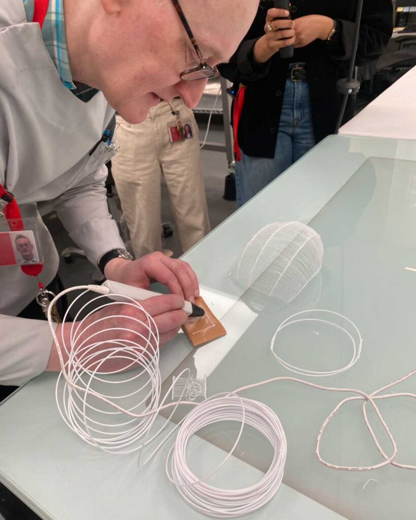 Seiran Tsuno showing her 3D pen technique to Glenn Petersen at The Met