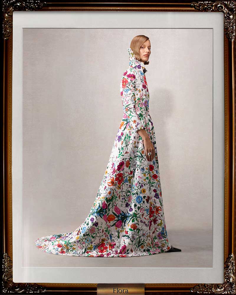 a woman in a long dress with a high slit