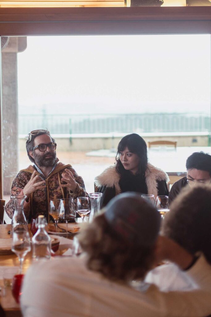 a group of people sitting around a table