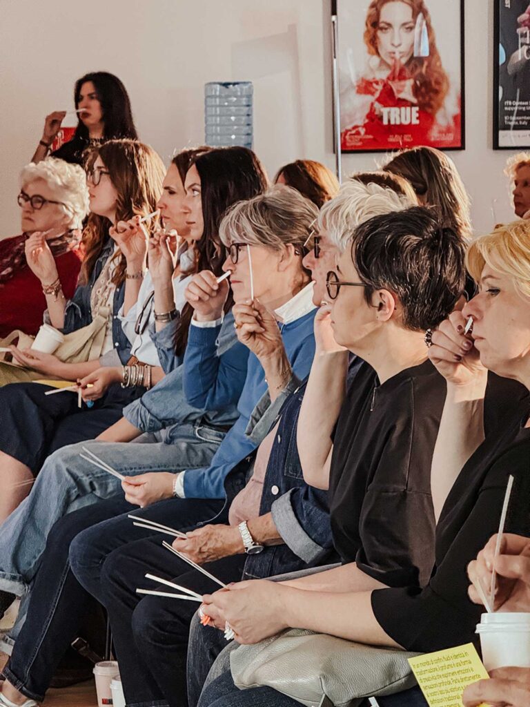 a group of women sitting next to each other