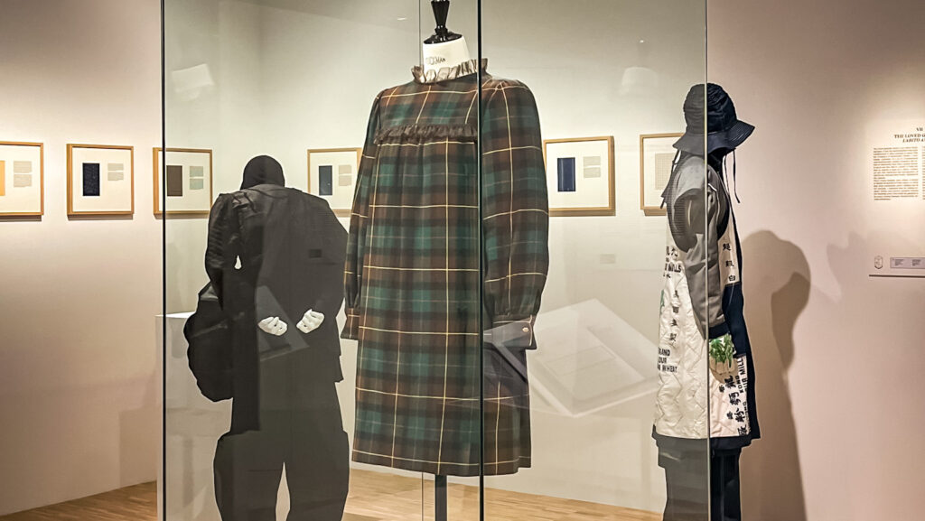 a couple of mannequins that are in a glass case