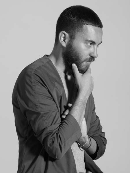 a black and white photo of a man with a beard