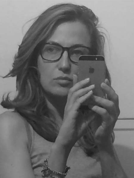 a black and white photo of a woman taking a selfie