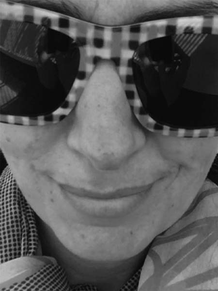 a close up of a person wearing sunglasses