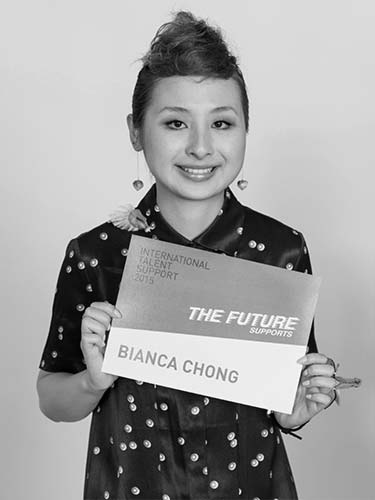 a girl holding a sign that says the future bilanca chong