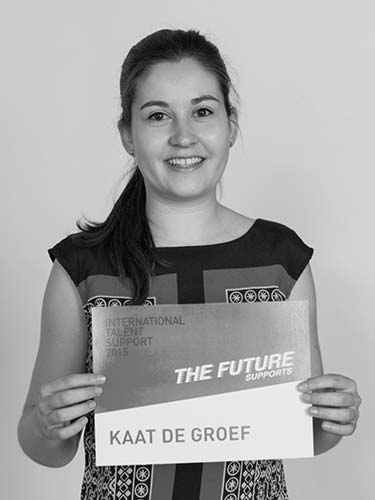 a woman holding a sign that says the future kaat de groef