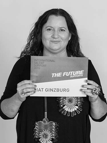 a woman holding a sign that reads the future