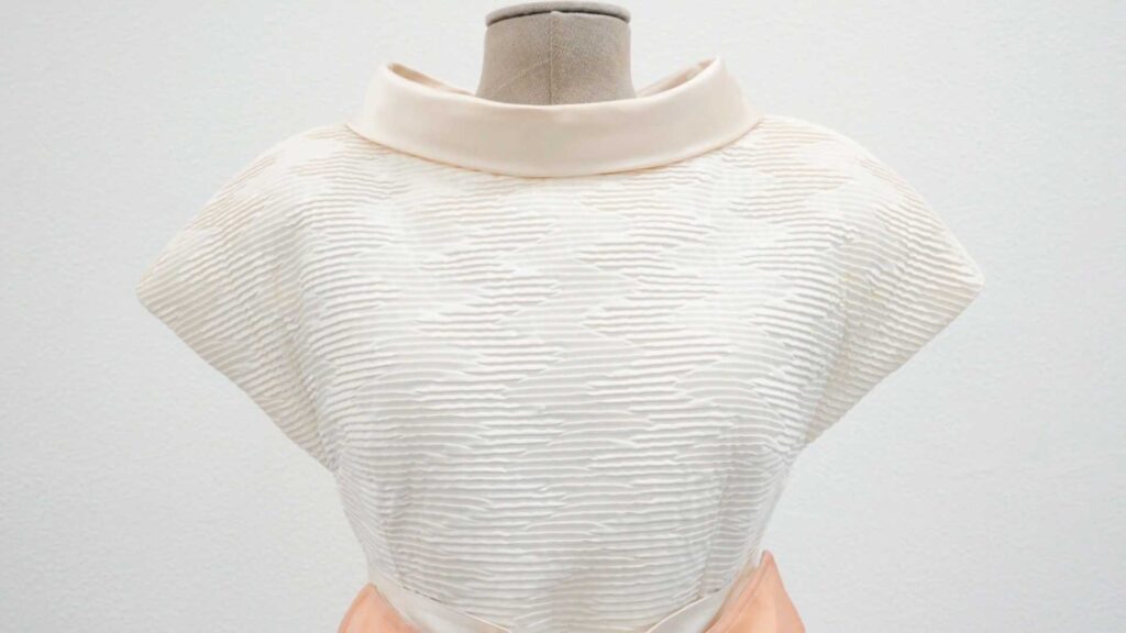 a mannequin with a white top on it