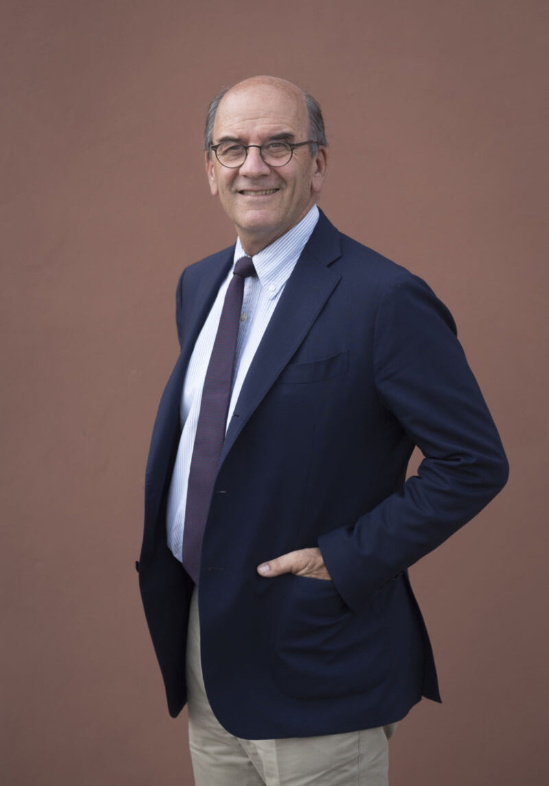 a man in a suit and tie posing for a picture