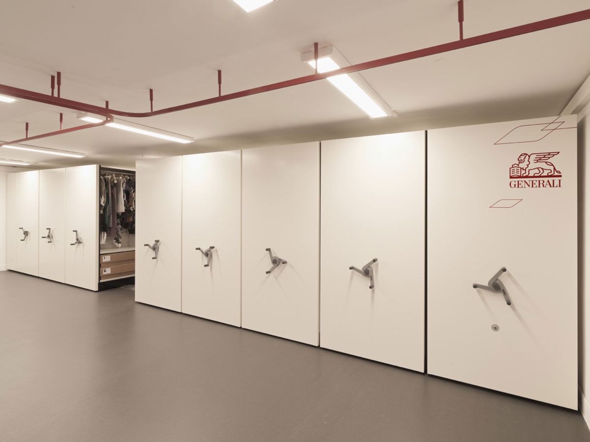 a room with a bunch of white lockers in it