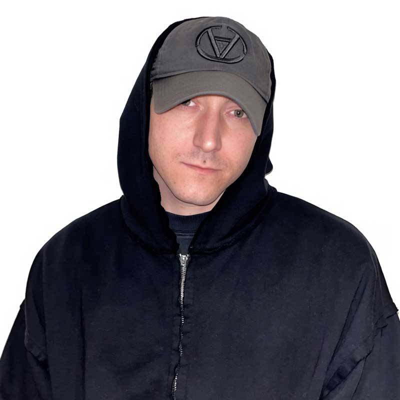 a man wearing a black hoodie and a cap
