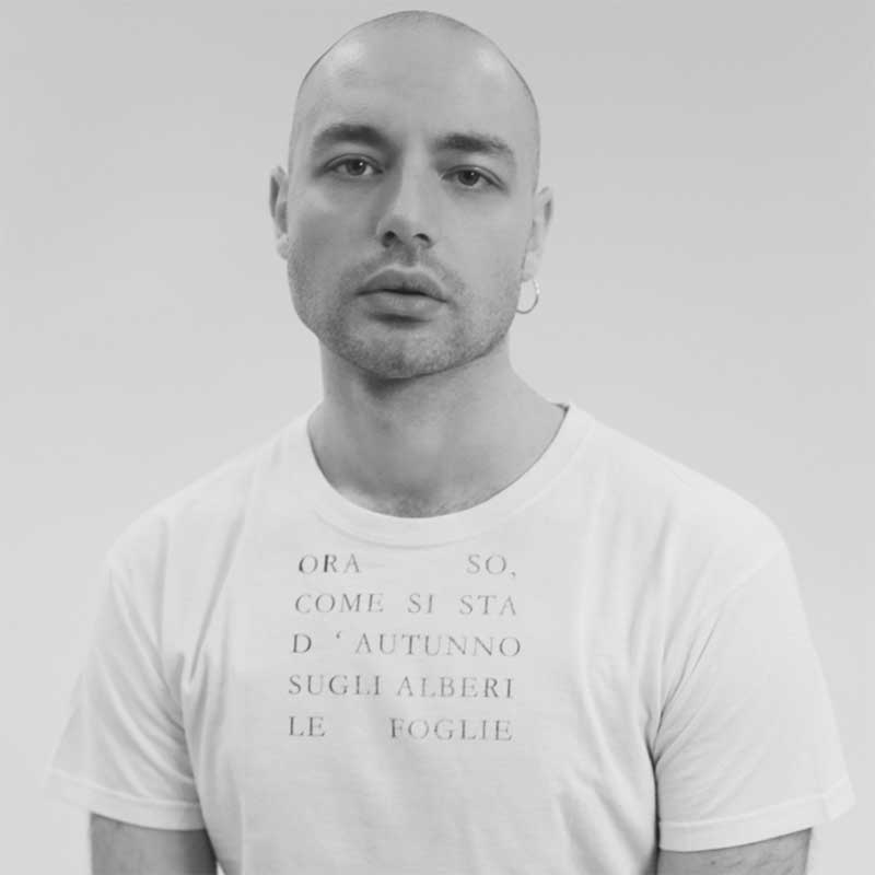 a man with a bald head wearing a t - shirt